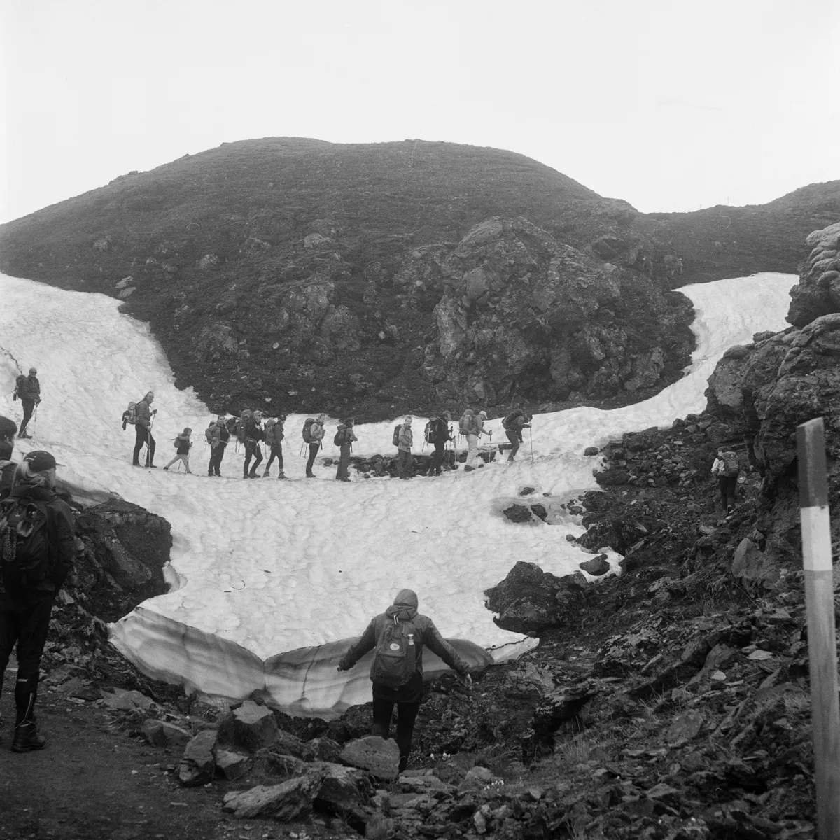 People hiking on a glacier